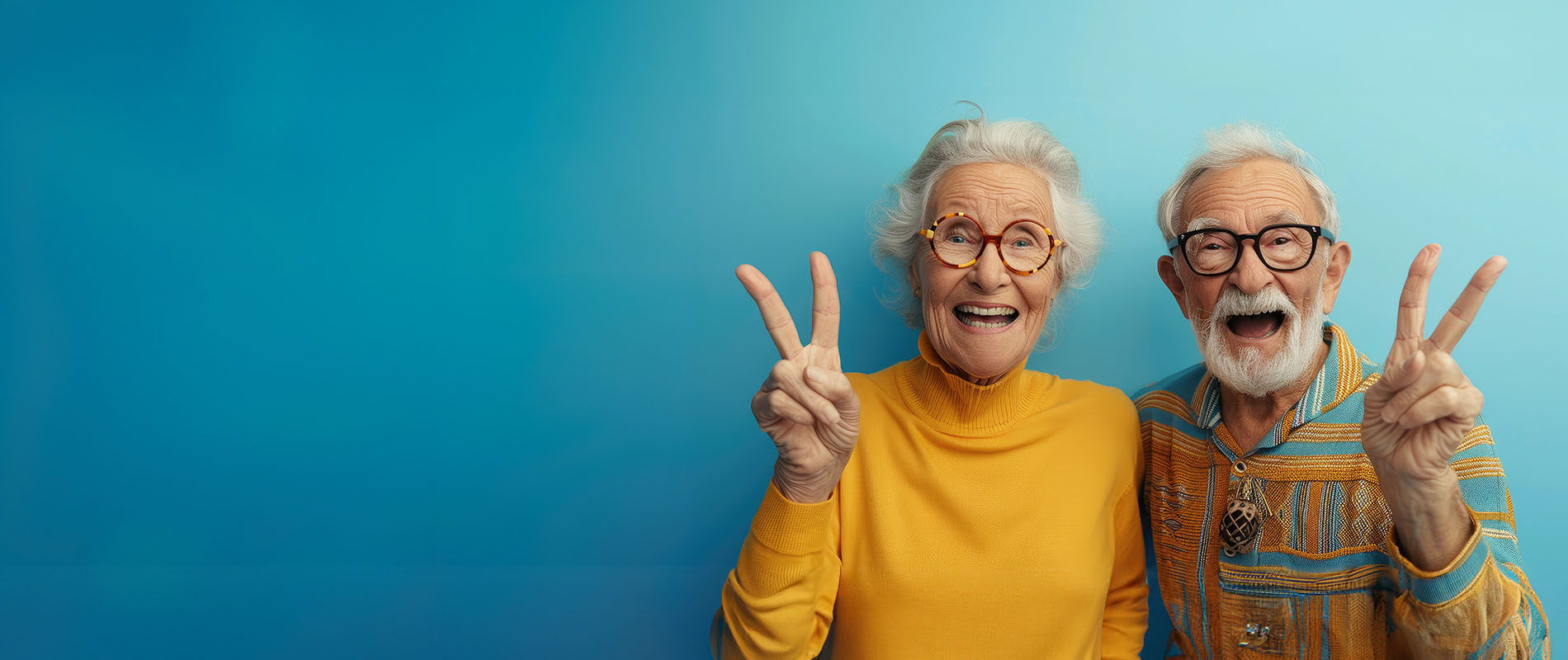 The image shows two older adults posing with peace signs, likely celebrating an event or milestone.